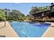Private pool surrounded by lush greenery, offering a tranquil and refreshing escape from the summer heat at 200 Camp Creek Trail, Peachtree City, GA 30269