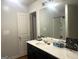 Bathroom with single sink vanity, medicine cabinet, and walk-in shower at 2282 Joplin St, Jonesboro, GA 30236