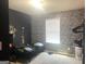 Bedroom with a textured wallpaper accent wall at 2282 Joplin St, Jonesboro, GA 30236
