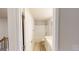 Bathroom view through an open doorway showcases the tile flooring and fixtures at 3402 Milan Ct # 1 Plapprox Sqft 2, Douglasville, GA 30135