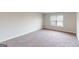 A standard bedroom with carpet and natural light at 3402 Milan Ct # 1 Plapprox Sqft 2, Douglasville, GA 30135