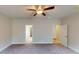 A cozy bedroom featuring a ceiling fan and plush carpet at 3402 Milan Ct # 1 Plapprox Sqft 2, Douglasville, GA 30135