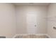 Bright laundry room features modern flooring and ample space for appliances at 3402 Milan Ct # 1 Plapprox Sqft 2, Douglasville, GA 30135