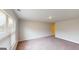 A well-lit room features neutral walls, plush carpeting, and a large window to offer a bright and airy ambiance at 3402 Milan Ct # 1 Plapprox Sqft 2, Douglasville, GA 30135