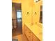 Bright bathroom featuring a double vanity and large mirror at 308 Bell Isle, Mcdonough, GA 30252