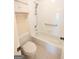 Bright bathroom featuring a tub and shower combination with safety bars and neutral accents at 308 Bell Isle, Mcdonough, GA 30252