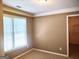 Bedroom with neutral paint, carpeted floors, and a bright window at 308 Bell Isle, Mcdonough, GA 30252
