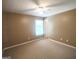 Spacious bedroom with a ceiling fan, carpet, and natural light from the window at 308 Bell Isle, Mcdonough, GA 30252