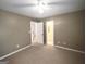 Spacious bedroom with neutral carpet flooring and en suite bathroom entrance at 308 Bell Isle, Mcdonough, GA 30252