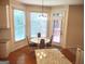 Bright breakfast area features large windows, table, and access to the porch at 308 Bell Isle, Mcdonough, GA 30252