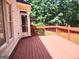 Outdoor deck with wooded view and access to the house at 308 Bell Isle, Mcdonough, GA 30252