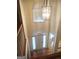 Bright foyer showcasing a chandelier, front door with sidelights, and wood floors at 308 Bell Isle, Mcdonough, GA 30252