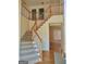 Elegant foyer featuring a staircase with wood railings and a view into the living spaces at 308 Bell Isle, Mcdonough, GA 30252