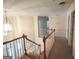 Hallway view from above, highlighting natural light and classic wooden railing at 308 Bell Isle, Mcdonough, GA 30252