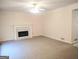 Spacious living room with fireplace and ceiling fan at 308 Bell Isle, Mcdonough, GA 30252
