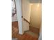 Carpeted stairs lead to the basement from a hardwood floor landing at 308 Bell Isle, Mcdonough, GA 30252
