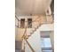 Wooden staircase with white railings at 308 Bell Isle, Mcdonough, GA 30252