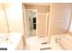 Bright bathroom with a soaking tub, neutral walls, and a walk-in closet at 235 Woodstream Way, Fayetteville, GA 30214