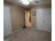 Bedroom with neutral carpet, 2 door closet, and adjacent bathroom at 235 Woodstream Way, Fayetteville, GA 30214