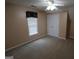 Bedroom featuring neutral carpet, a ceiling fan, a single window, and 2 door closet at 235 Woodstream Way, Fayetteville, GA 30214