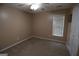 Bedroom with neutral carpet, single window, and a 2 door closet at 235 Woodstream Way, Fayetteville, GA 30214