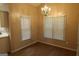 Sunlit breakfast nook with laminate flooring, a chandelier, and windows offering pleasant views at 235 Woodstream Way, Fayetteville, GA 30214