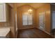 Sunlit breakfast nook with laminate flooring, a chandelier, and windows offering pleasant views at 235 Woodstream Way, Fayetteville, GA 30214
