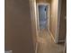 Neutral hallway features carpet flooring and access to rooms, creating a seamless transition throughout the home at 235 Woodstream Way, Fayetteville, GA 30214