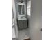 Bathroom featuring a neutral colored vanity with drawers, a mirror, modern fixtures, and marble flooring at 1858 Sahara Se Dr, Atlanta, GA 30316
