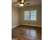 Bright bedroom with a window letting in natural light and a ceiling fan at 1858 Sahara Se Dr, Atlanta, GA 30316