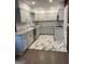 Modern kitchen with white cabinetry, granite countertops, stainless appliances, and decorative tile flooring at 1858 Sahara Se Dr, Atlanta, GA 30316