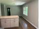Kitchen area with island, granite countertops, and paneled walls, perfect for entertaining at 1858 Sahara Se Dr, Atlanta, GA 30316
