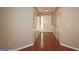 Well-lit hallway with hardwood floors and detailed trim work throughout at 3350 Cooper Woods Dr, Loganville, GA 30052