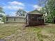 Backyard featuring a screened-in porch area, grass, and the exterior of the home at 6026 Woodcreek Dr, Woodstock, GA 30188