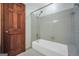 This bathroom features a combination shower and tub with grey tile surround at 428 Turner Rd, Mcdonough, GA 30252