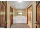Bathroom featuring large garden tub with tile surround and a separate shower at 428 Turner Rd, Mcdonough, GA 30252