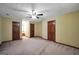 Bedroom features soft carpet, neutral paint, and a ceiling fan for comfortable living at 428 Turner Rd, Mcdonough, GA 30252