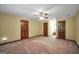 Bedroom features soft carpet, neutral paint, and a ceiling fan for comfortable living at 428 Turner Rd, Mcdonough, GA 30252