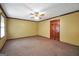 Spacious bedroom featuring neutral paint, carpet, and a ceiling fan for comfortable living at 428 Turner Rd, Mcdonough, GA 30252