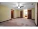 Bedroom features soft carpet, neutral paint, and a ceiling fan for comfortable living at 428 Turner Rd, Mcdonough, GA 30252