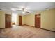 Bedroom features soft carpet, neutral paint, and a ceiling fan for comfortable living at 428 Turner Rd, Mcdonough, GA 30252