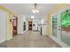 Spacious eat-in kitchen featuring white cabinetry, tile flooring, and access to the outdoor deck at 428 Turner Rd, Mcdonough, GA 30252