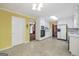 Large eat-in kitchen with access to a separate dining area and white appliances and cabinets at 428 Turner Rd, Mcdonough, GA 30252