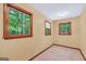 Inviting room with wood-trimmed windows, providing ample natural light and tile flooring at 428 Turner Rd, Mcdonough, GA 30252