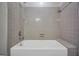 The bathroom features a combined shower and tub with neutral-colored tile surround at 428 Turner Rd, Mcdonough, GA 30252
