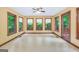 Bright sunroom features 3 large windows providing ample natural light and beautiful views of the surrounding landscape at 428 Turner Rd, Mcdonough, GA 30252
