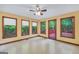 Bright sunroom features 4 large windows providing ample natural light and views to a patio at 428 Turner Rd, Mcdonough, GA 30252
