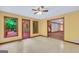 Bright sunroom adjacent to the living room with 3 large windows and a door leading to the outdoor patio at 428 Turner Rd, Mcdonough, GA 30252