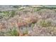 Stunning aerial view of a wooded property featuring a private pond reflecting the surrounding landscape at 679 Bo Bo Banks Rd, Grantville, GA 30220