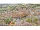 Aerial view of a lake and homes surrounded by mature trees at 679 Bo Bo Banks Rd, Grantville, GA 30220